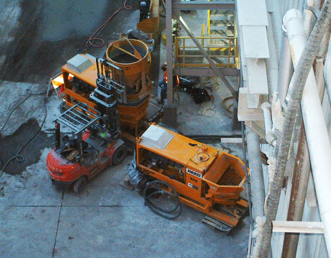 two electric shotcrete pumps on site for spraying refractory